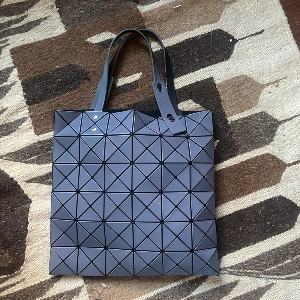 Issey Miyake Bao Bao tote in gray.